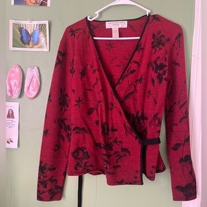 Red wrap sweater with black and beaded floral details
